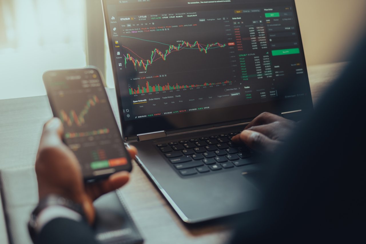 Trading charts on laptop screen